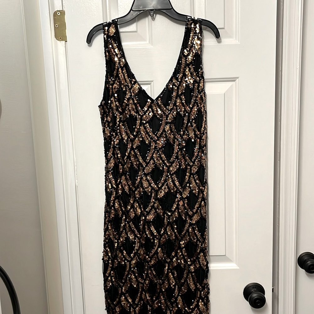 Black and gold sequined midi dress. Fringe hits mid calf